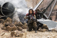 <p>This brash fighter (Jiang Wen) scoffs at his buddy’s fascination with the Force, preferring to use his big gun when battling the enemy. But the two are inseparable. As Wen says, Baze goes wherever Chirrut goes. (Photo: Lucasfilm) </p>