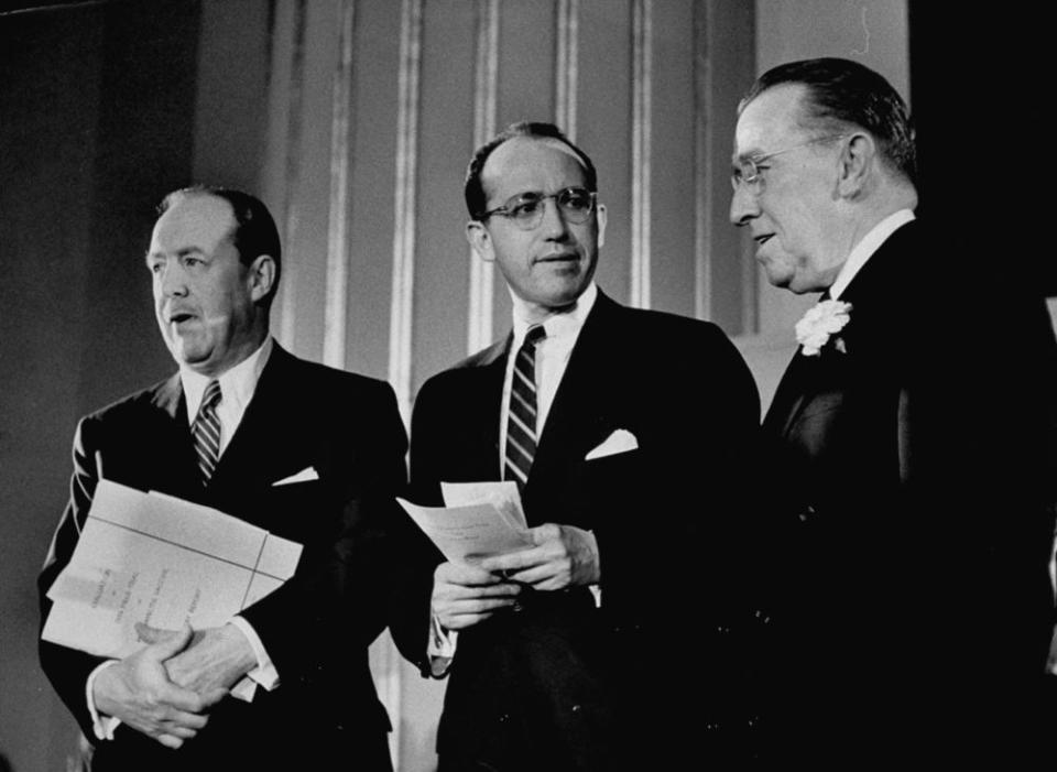 Inventor of the polio vaccine Dr. Jonas E. Salk (C) standing with Thomas Francis (L) during a press conference. (Photo by Al Fenn/The LIFE Picture Collection/Getty Images)