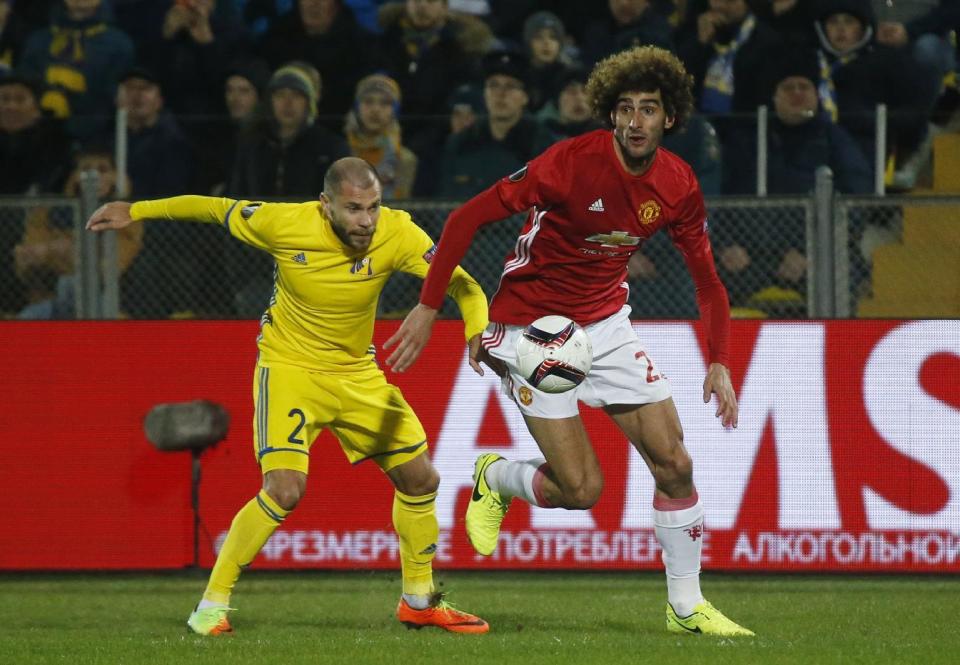 <p>Rostov’s Timofei Kalachev tries to keep up with Manchester United’s Marouane Fellaini </p>