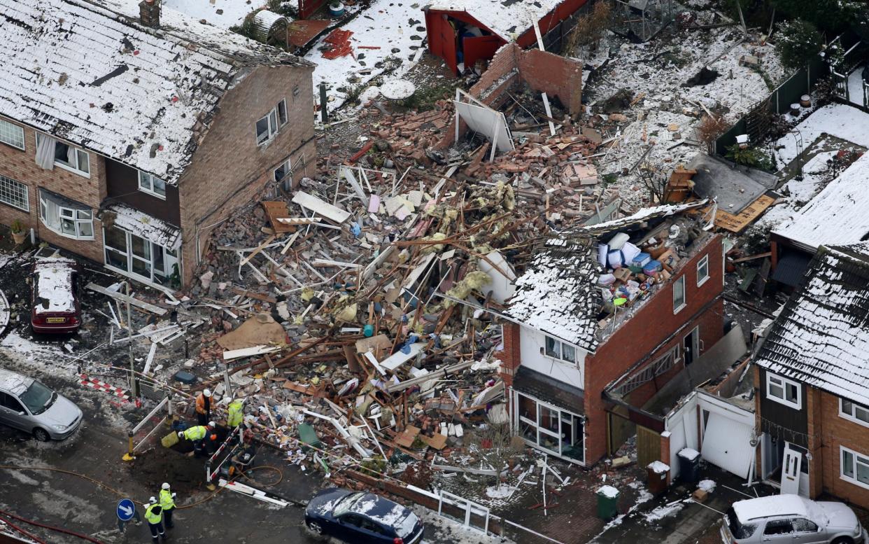 An aerial view shows the destroyed house after a huge 'bang' shook doors and windows - SWNS.com