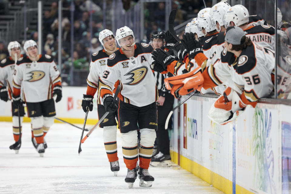 Anaheim Ducks right wing Jakob Silfverberg, center, is congratulated for a shorthanded goal during the third period of the team's NHL hockey game against the Seattle Kraken on Thursday, March 28, 2024, in Seattle. The Kraken won 4-2. (AP Photo/Jason Redmond)