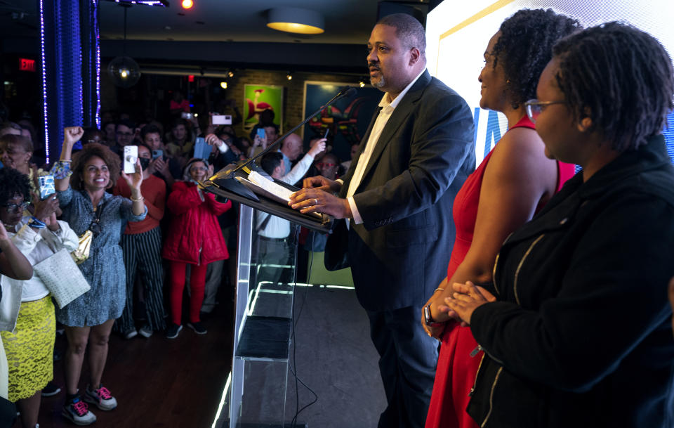 Alvin Bragg, a former top deputy to New York's attorney general, stands with his family as he speaks to supporters in New York, late Tuesday, June 22, 2021. (AP Photo/Craig Ruttle)