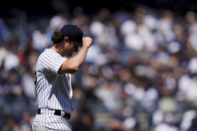 New York Yankees starting pitcher Gerrit Cole reacts after giving up three runs in the first inning of an opening day baseball game against the Boston Red Sox, Friday, April 8, 2022, in New York. (AP Photo/John Minchillo)