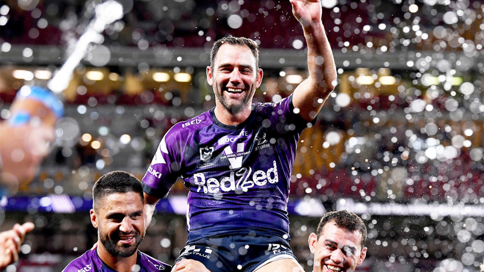 Cameron Smith (pictured) being chaired off the field by teammates.