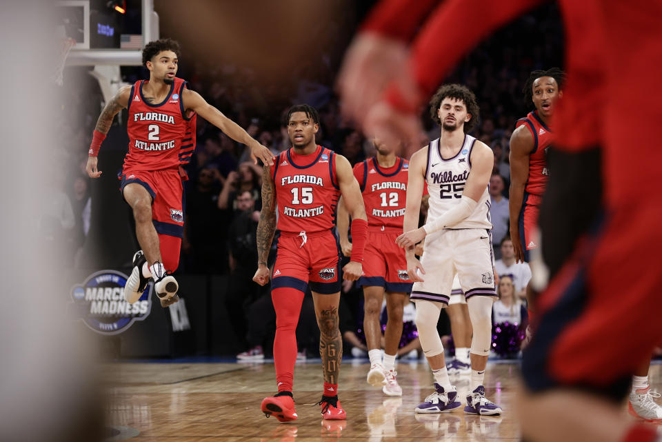 Florida Atlantic players celebrate after defeating Kansas State in an Elite 8 college basketball game in the NCAA Tournament's East Region final, Saturday, March 25, 2023, in New York. (AP Photo/Adam Hunger)