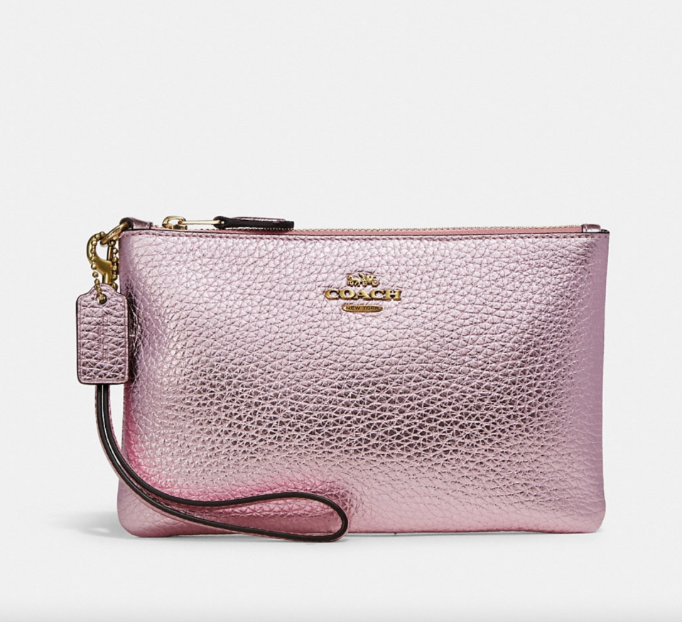 Small Wristlet in light pink metallic leather (Photo via Coach)