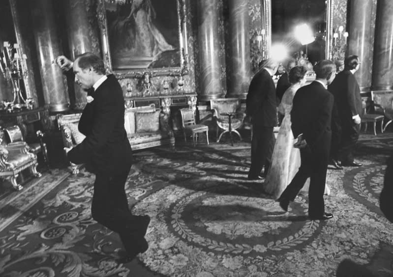 Pierre Trudeau does a well-rehearsed pirouette behind the Queen's back at Buckingham Palace in 1977. 