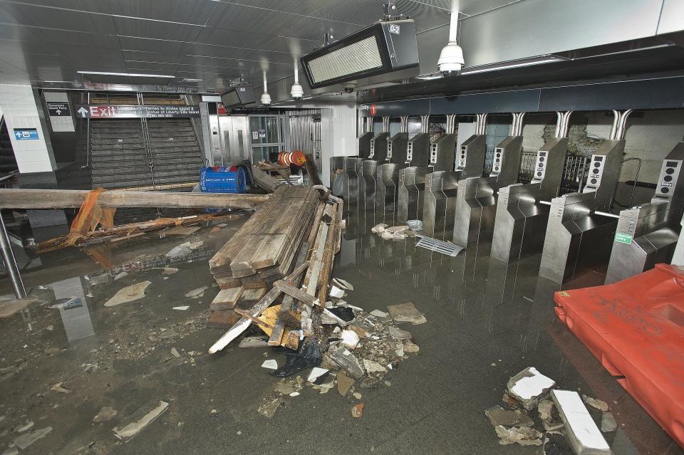 This photo provided by the Metropolitan Transportation Authority shows the South Ferry subway station after it was flooded by seawater during superstorm Sandy on Tuesday, Oct. 30, 2012. Sandy, the storm that made landfall Monday, caused multiple fatalities, halted mass transit and cut power to more than 6 million homes and businesses. (AP Photo/ Metropolitan Transportation Authority)