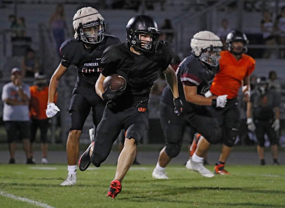 Three-teams compete during a high school football scrimmage between Golden West, Mt. Whitney and Woodlake at Visalia Community Stadium at Golden West in Visalia, Calif. on Friday, Aug. 11, 2023.