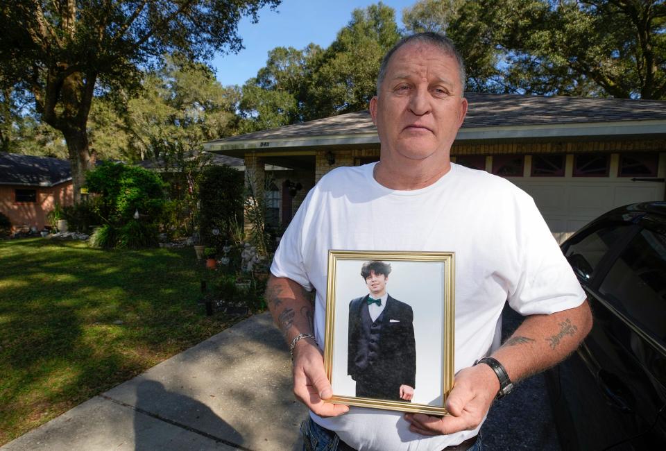 Andre Boren holds a picture of his 17-year-old son, Landon Boren, who died from a fentanyl overdose earlier this year, Wednesday, Nov. 29, 2023.