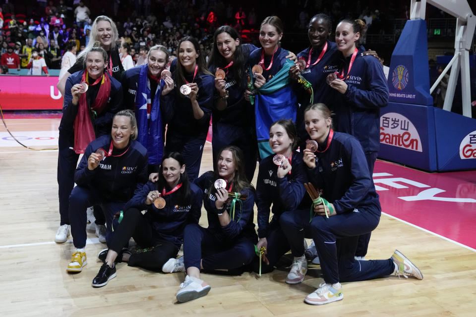 Bronze medals Australia pose for a team photo at the women's Basketball World Cup in Sydney, Australia, Saturday, Oct. 1, 2022. (AP Photo/Mark Baker)