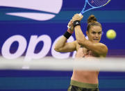 Maria Sakkari, of Greece, returns a shot to Emma Raducanu, of Great Britain, during the semifinals of the US Open tennis championships, Thursday, Sept. 9, 2021, in New York. (AP Photo/Frank Franklin II)