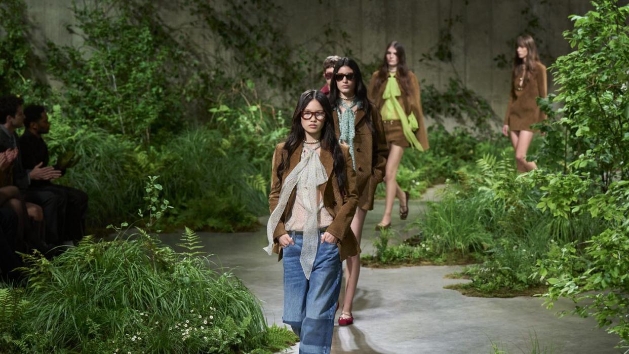 models walk the runway at the gucci cruise show