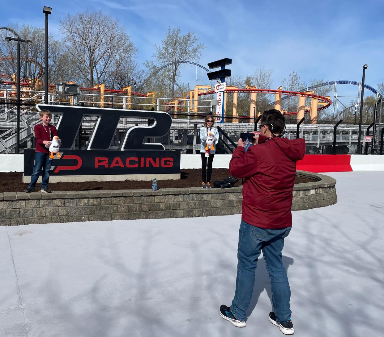 William Chew, of Mentor, takes a picture of his kids Billy, 8, and Phoebe, 10, in front of Cedar Point's Top Thrill 2 roller coaster.