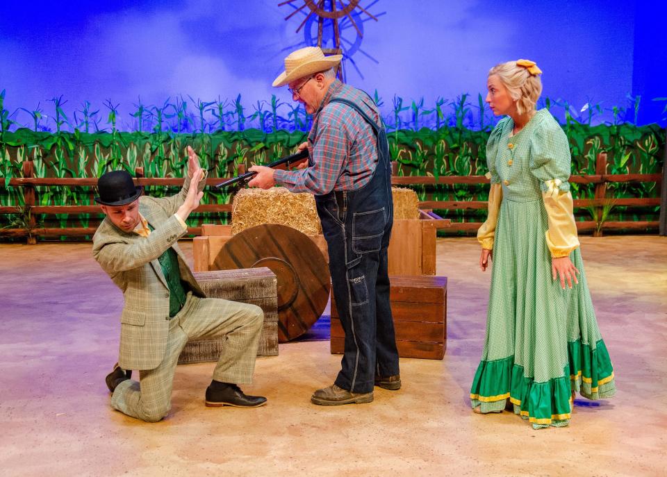 A shotgun wedding in "Oklahoma!" is threatened by Andrew Carnes (Jeff Baker) after hearing that Ali Hakim (Randy Rininger Kline) has been flirting with Ado Annie (Clare LaTourette). The Carnation City Players' production will run Feb. 16-18 and Feb. 23-25 at Firehouse Theater in Alliance.