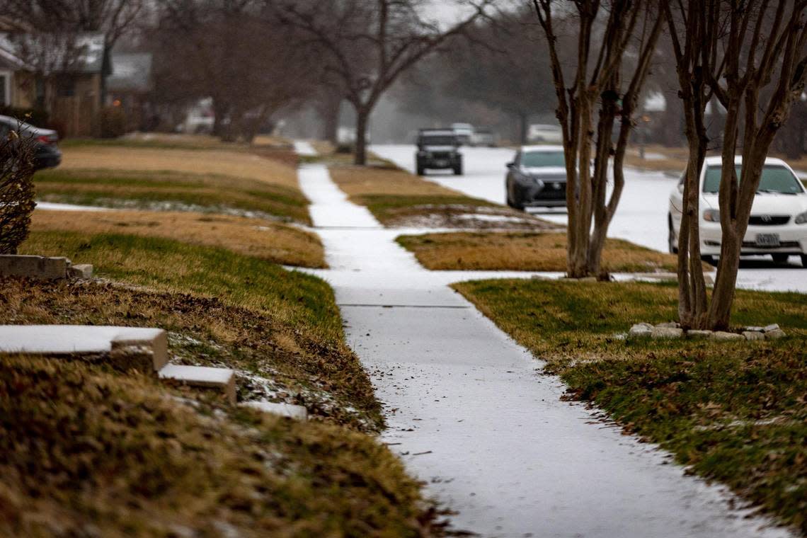 Sidewalks are frozen over during icy weather in Fort Worth on Tuesday, Jan. 31, 2023. Winter storm conditions have extended through Thursday morning as freezing rain continues.