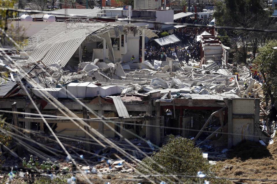 Rescue workers are seen at the site of an explosion at a maternity hospital in Mexico City