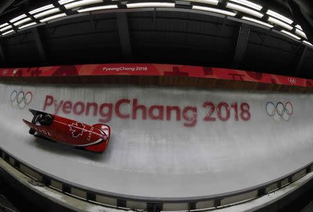 Bobsleigh - Pyeongchang 2018 Winter Olympics - Men's 2-man Finals - Olympic Sliding Centre - Pyeongchang, South Korea - February 19, 2018 - Alexander Kopacz and Justin Kripps of Canada in action. REUTERS/Arnd Wiegmann