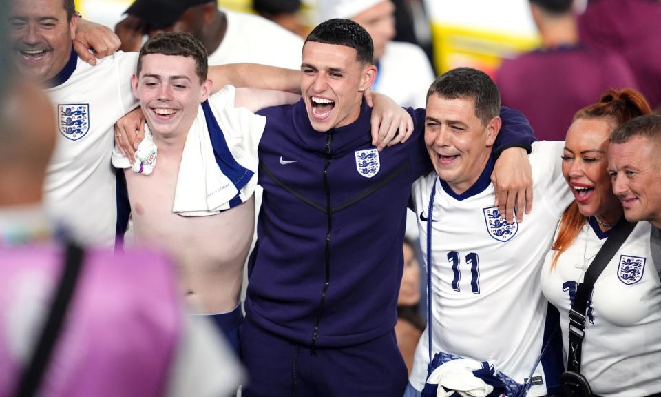 <span>England's Phil Foden (centre) celebrates with his family after the semi-final win over the Netherlands.</span><span>Photograph: Adam Davy/PA</span>