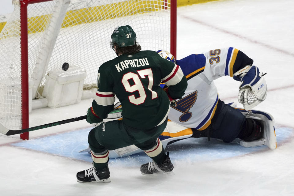 Minnesota Wild's Kirill Kaprizov (97) scores his third goal of the night, against St. Louis Blues goalie Ville Husso during the third period of Game 2 of an NHL hockey Stanley Cup first-round playoff series Wednesday, May 4, 2022, in St. Paul, Minn. The Wild won 6-2. (AP Photo/Jim Mone)