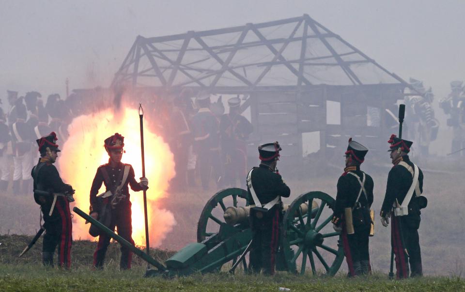 Members of historic clubs wearing 1812-era uniforms take part in a staged battle re-enactment to mark the 200th anniversary of the battle of Borodino, in Borodino, about 110 km (70 miles) west of Moscow, Sunday, Sept. 2, 2012. The Battle of Borodino in 1812 was the largest and bloodiest single-day action of the French invasion of Russia. (AP Photo/Mikhail Metzel)