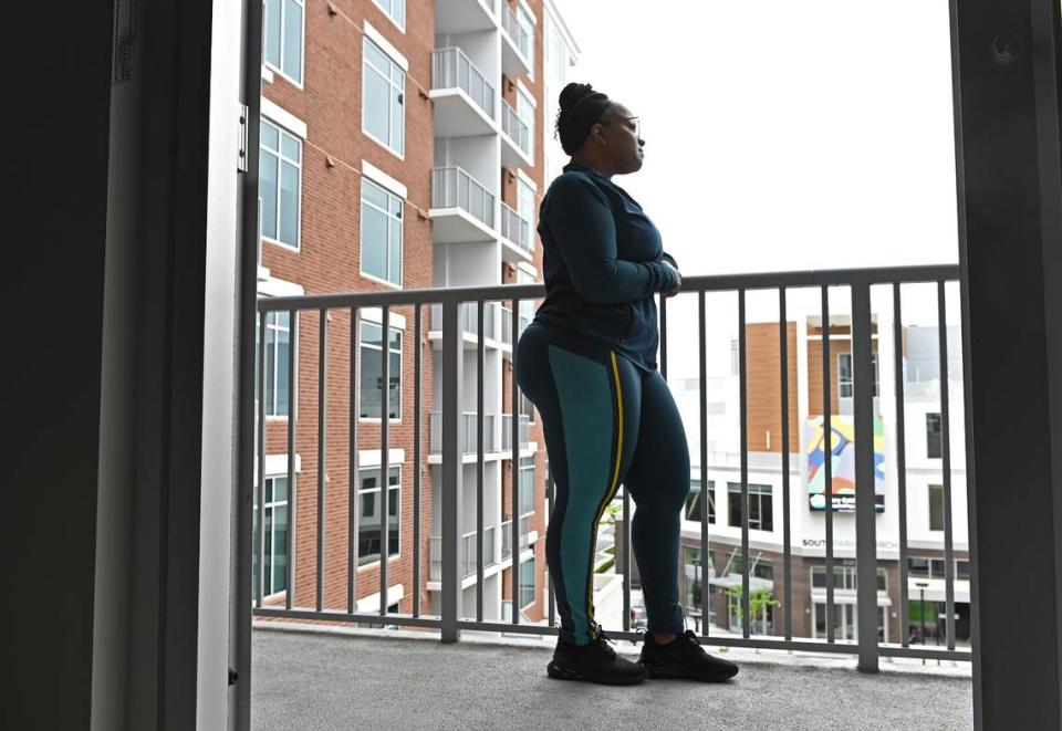 Marshette Foster on Thursday, May 5, 2022 in Charlotte, looking out from her fourth-floor apartment at Element SouthPark in south Charlotte.