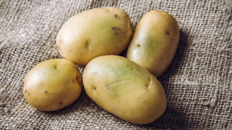 potatoes with greenish skin color