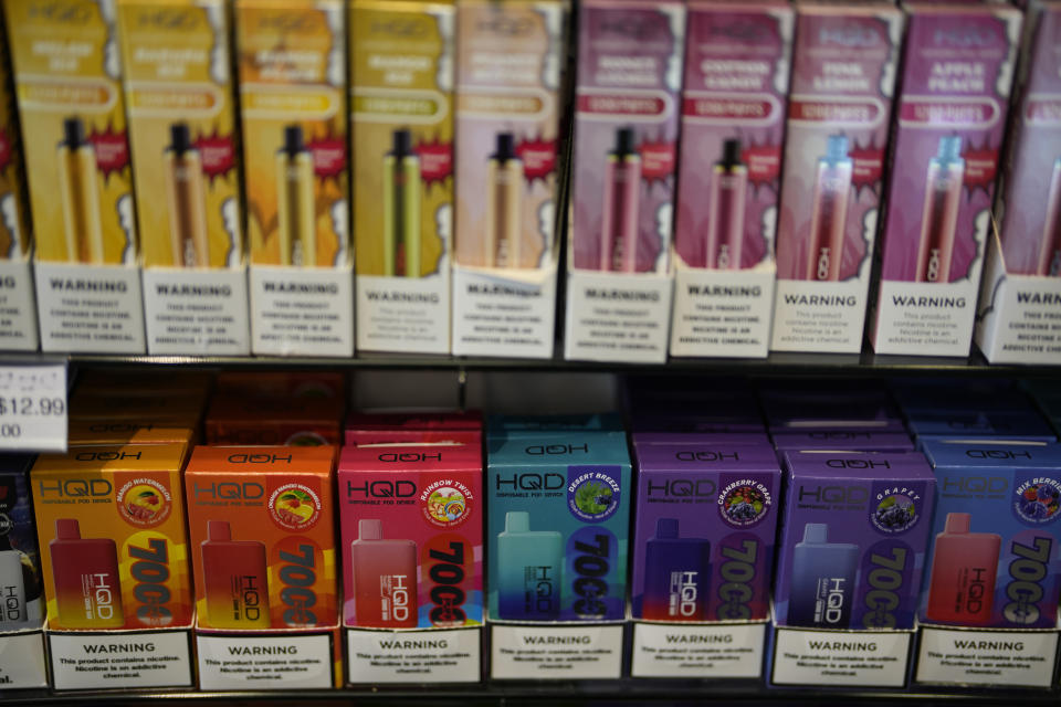 Disposable electronic cigarette devices made by the Chinese brand HQD are displayed for sale at Vapes N Smoke in Pinecrest, Fla., Monday, June 26, 2023. Since 2020, the number of different e-cigarette devices for sale in the U.S. has exploded to more than 9,000, a nearly three-fold increase driven almost entirely by a wave of disposable vapes from China. (AP Photo/Rebecca Blackwell)