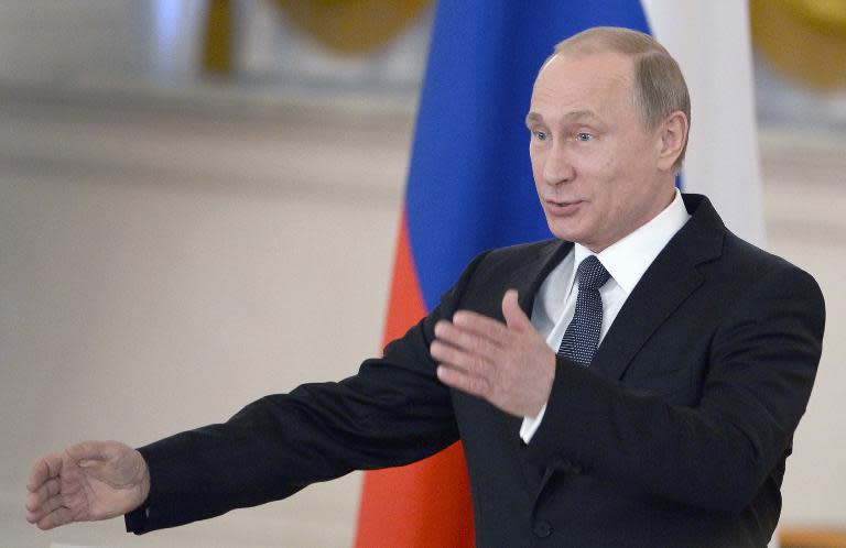 Russian President Vladimir Putin speaks at the Kremlin in Moscow on May 19, 2015