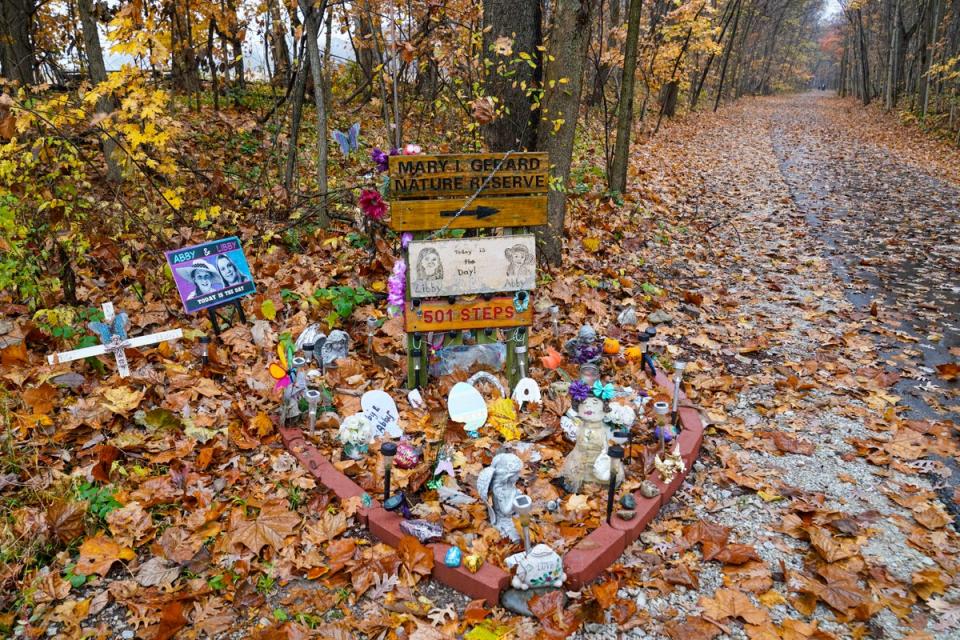 Makeshift memorial to Abby and Libby (Copyright 2022 The Associated Press. All rights reserved.)