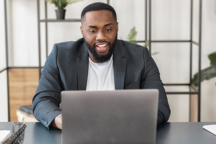 A financial advisor engaging with potential clients during a webinar. 