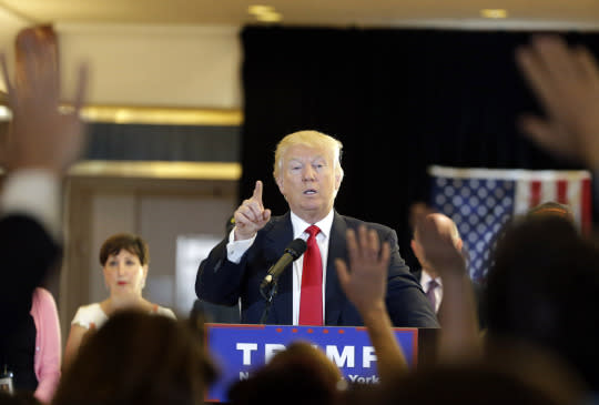 Donald Trump takes questions from the media. (Photo: EPA/Jason Szenes)