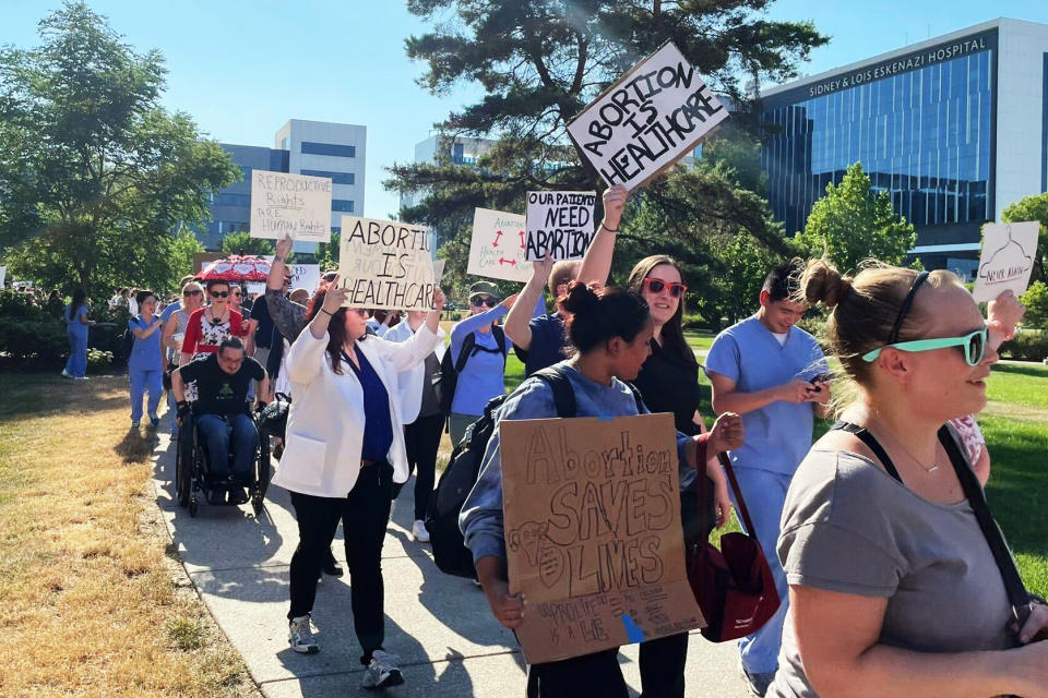 Image: Health care workers and abortion-rights supporters protest following the Supreme Court decision to overturn Roe v. Wade in front of a public hospital in Indianapolis on June 29, 2022. (Courtesy Lucy Brown)