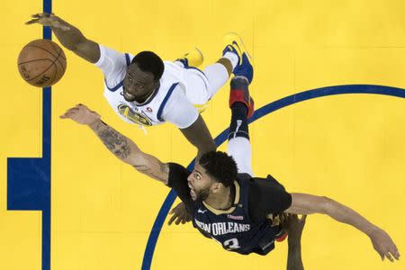 May 8, 2018; Oakland, CA, USA; Golden State Warriors forward Draymond Green (23) and New Orleans Pelicans forward Anthony Davis (23) fight for a rebound during the second half in game five of the second round of the 2018 NBA Playoffs at Oracle Arena. The Warriors defeated the Pelicans 113-104. Mandatory Credit: Kyle Terada-USA TODAY Sports