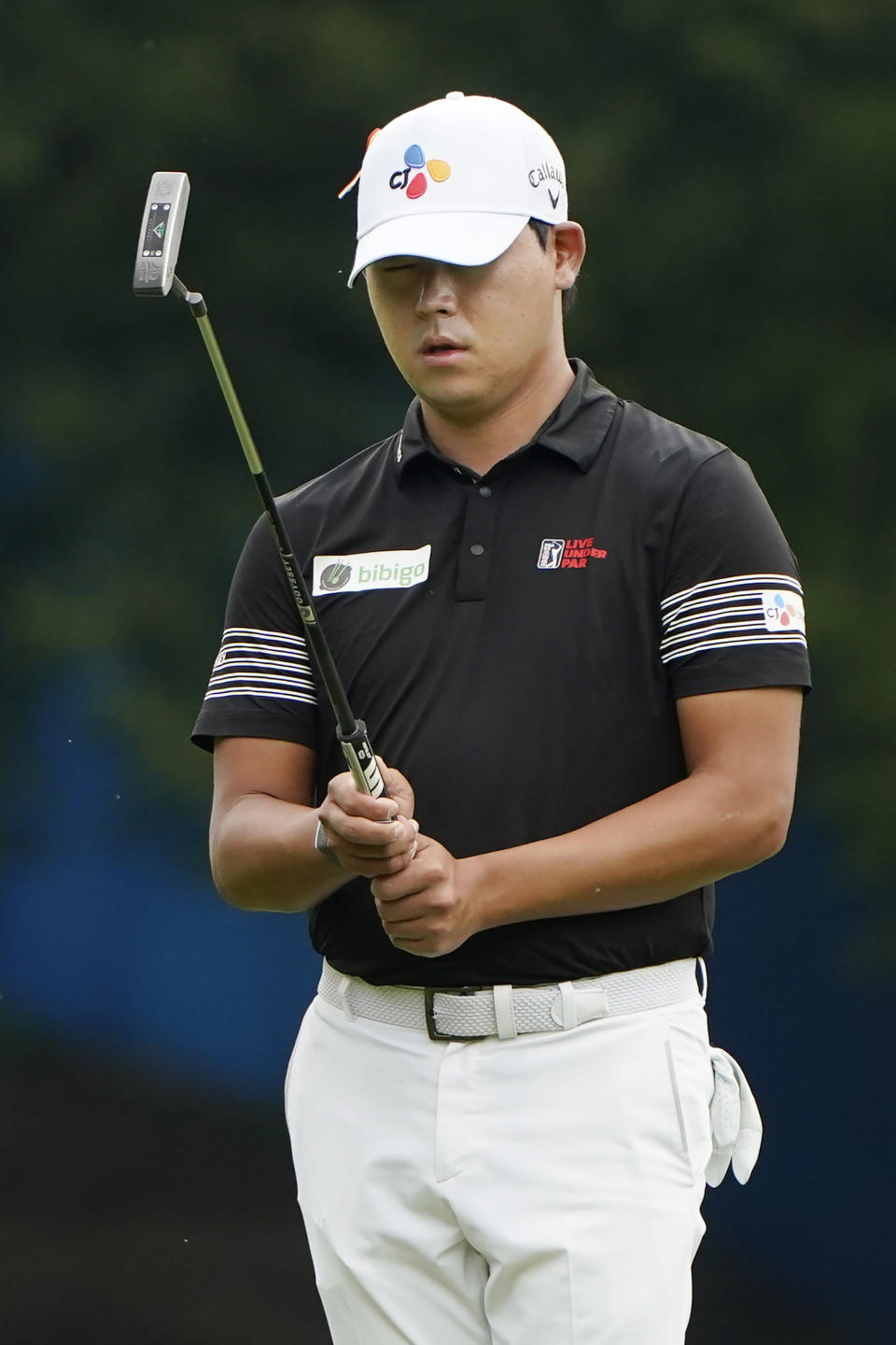 Si Woo Kim, of South Korea, lines up a putt on the first hole during the third round of the Wyndham Championship golf tournament at Sedgefield Country Club on Saturday, Aug. 15, 2020, in Greensboro, N.C. (AP Photo/Chris Carlson)