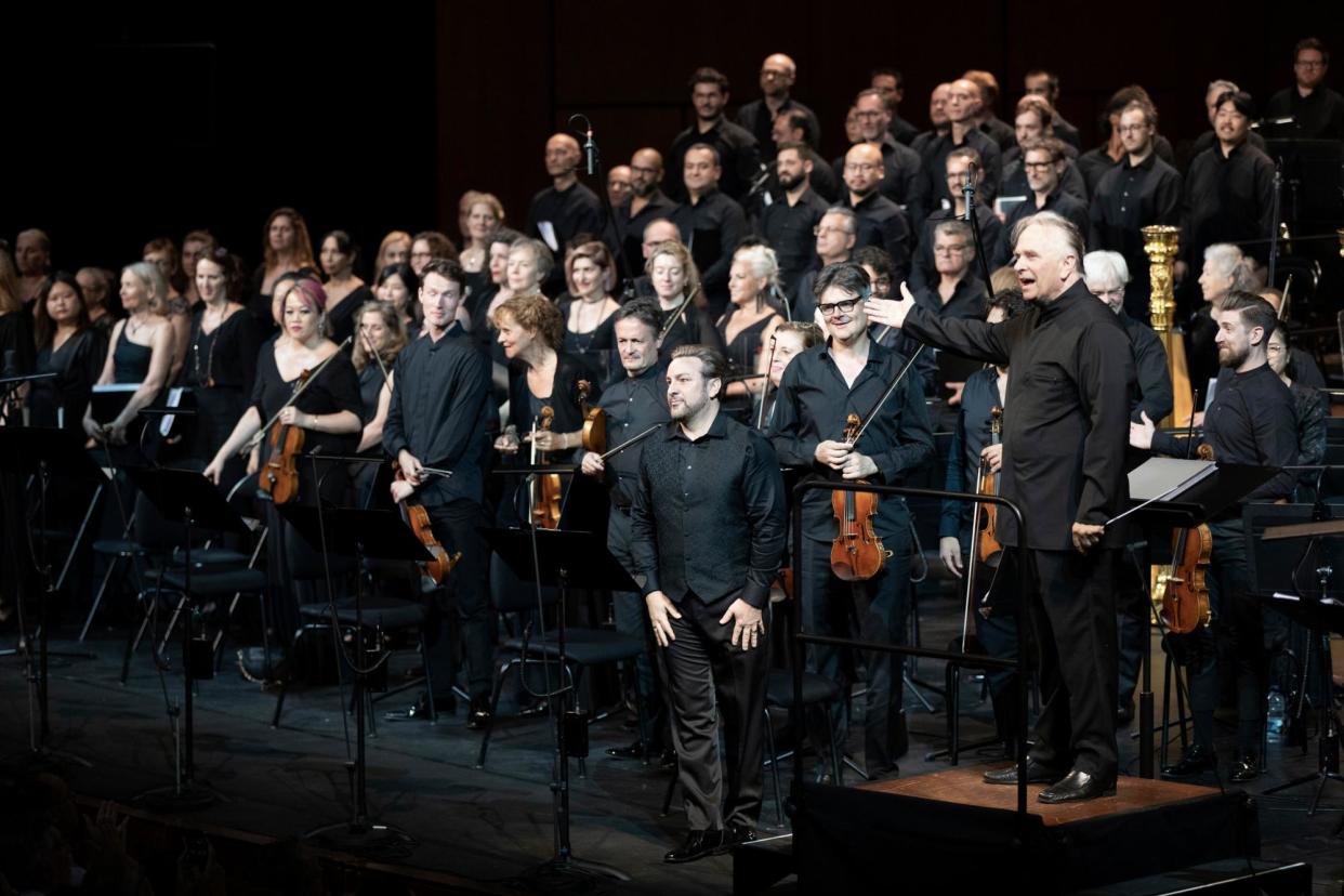 <span>Conductor Mark Elder, right, and company take a bow after their performance of Le prophète in Aix-en-Provence, 17 July 2023.</span><span>Photograph: Vincent Beaume</span>