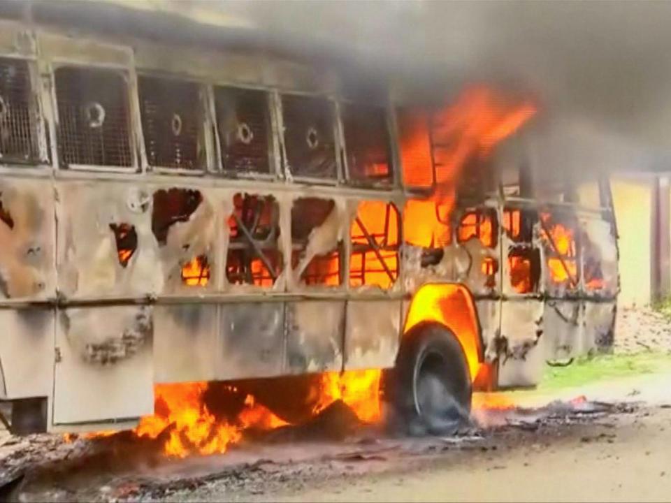 A bus on fire during a protest against the construction of a copper smelter by Vedanta Resources, in Thoothukudi (ANI via Reuters)