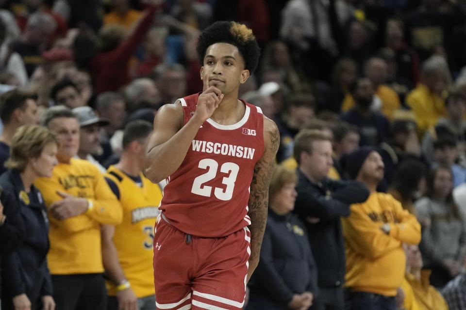 Wisconsin's Chucky Hepburn reacts after making a three-pointer during the second half of an NCAA college basketball game against Marquette Saturday, Dec. 3, 2022, in Milwaukee. Wisconsin won 80-77 in overtime. (AP Photo/Morry Gash)