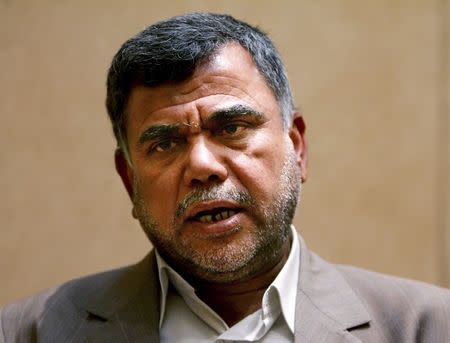 Hadi al-Ameri, the leader of Iraq's Badr Brigade, a Shi'ite militia, speaks during an interview in Baghdad in this June 28, 2005 file photo. REUTERS/Faleh Kheiber/Files