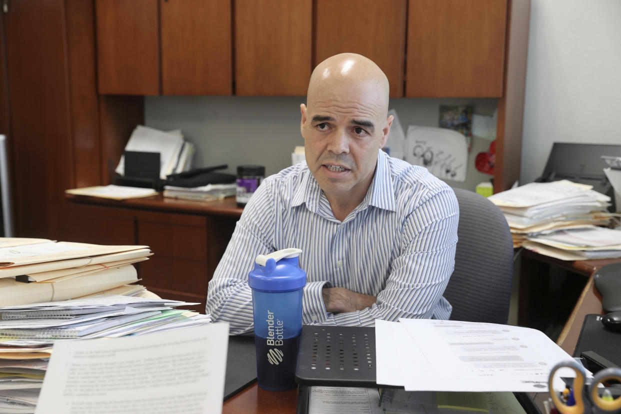 In this May 11, 2022, file photo, Clark County Public Administrator Robert Telles, in his Las Vegas office. Police say they are serving search warrants in connection with the fatal stabbing of a Las Vegas newspaper reporter last week. In a statement Wednesday, Sept. 7, 2022 Metro Police didn’t specify where they were searching in connection with the death of reporter Jeff German. But the Las Vegas Review-Journal reported uniformed officers and police vehicles were seen outside the home of Clark County Public Administrator Robert Telles. (K.M. Cannon/Las Vegas Review-Journal via AP)