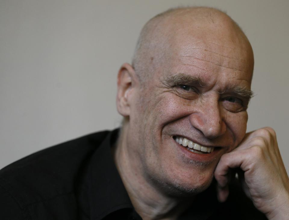 FILE - Wilko Johnson at his home in West Cliff on Sea, England, Tuesday, Jan. 29, 2013. Wilko Johnson, the guitarist with British blues-rock band Dr. Feelgood who had an unexpected career renaissance after being diagnosed with terminal cancer, has died it was announced Wednesday, Nov. 23, 2022. He was 75. (AP Photo/Kirsty Wigglesworth, file)