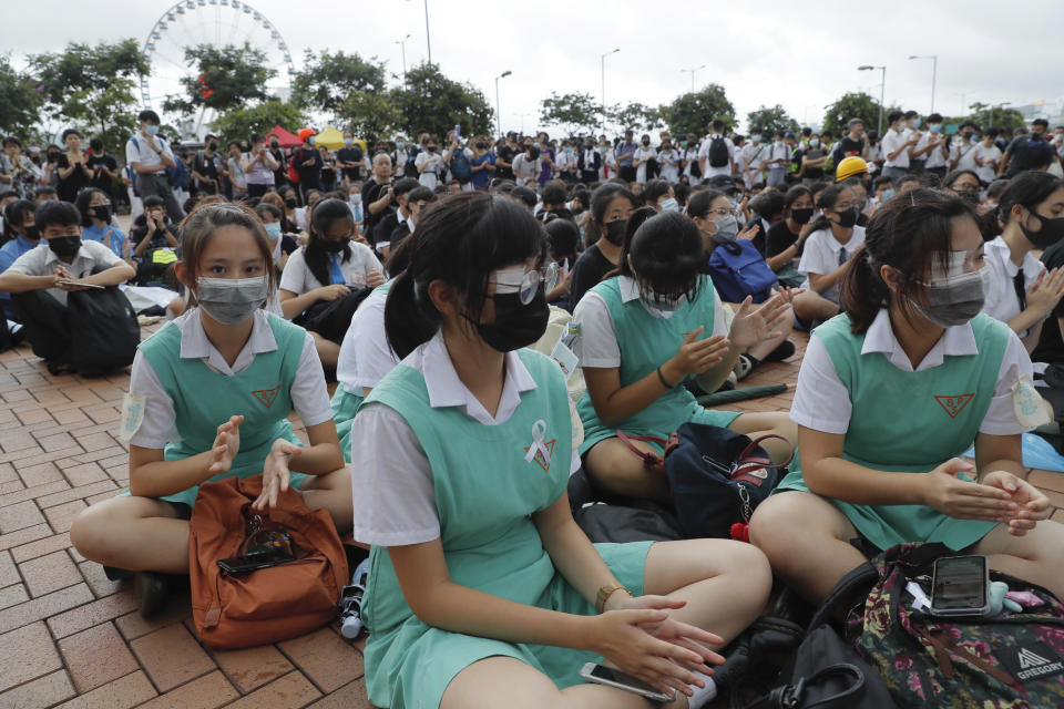 Secondary students sit on the ground during a protest at Admiralty in Hong Kong, on Monday, Sept. 2, 2019. Hong Kong has been the scene of tense anti-government protests for nearly three months. The demonstrations began in response to a proposed extradition law and have expanded to include other grievances and demands for democracy in the semiautonomous Chinese territory. (AP Photo/Kin Cheung)