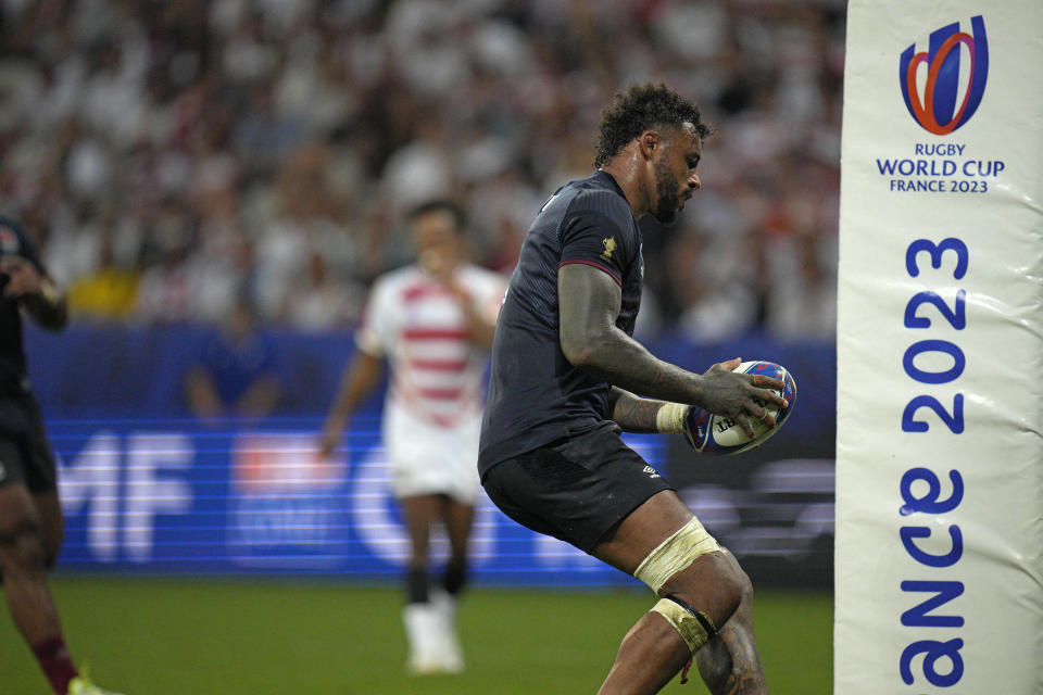 England's Courtney Lawes scores a try during the Rugby World Cup Pool D match between England and Japan in the Stade de Nice, in Nice, France Sunday, Sept. 17, 2023. (AP Photo/Daniel Cole)