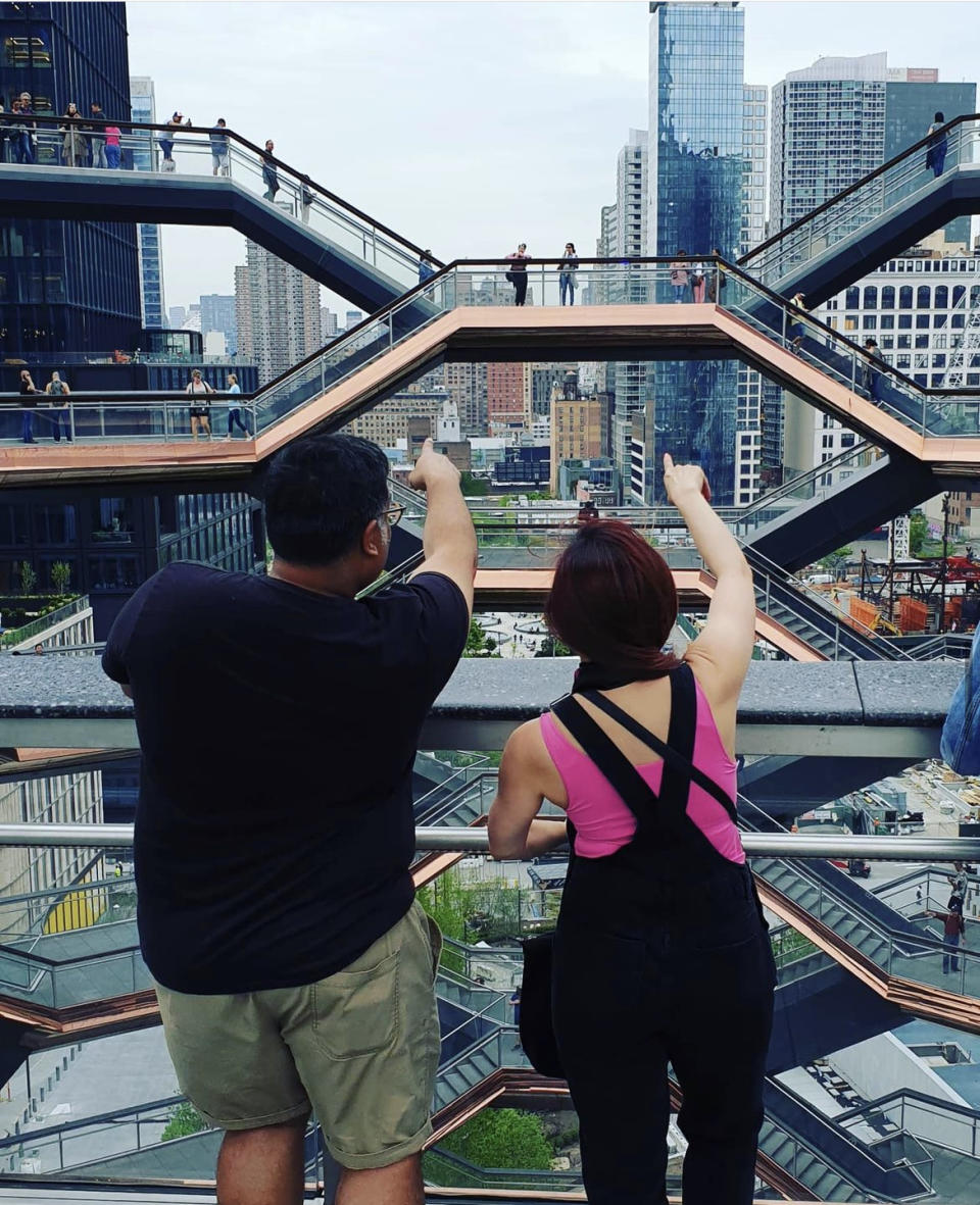 Man and woman atop the Hudson Yards Vessel