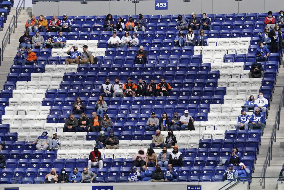 Fans watch the first half of an NFL football game between the Indianapolis Colts and the Cincinnati Bengals, Sunday, Oct. 18, 2020, in Indianapolis. (AP Photo/AJ Mast)