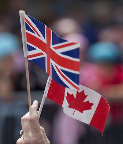 Canadian and Union Jack flags are seen at Queen Elizabeth’s unveiling of a statue of jazz legend Oscar Peterson in Ottawa in 2010. THE CANADIAN PRESS/Pawel Dwulit