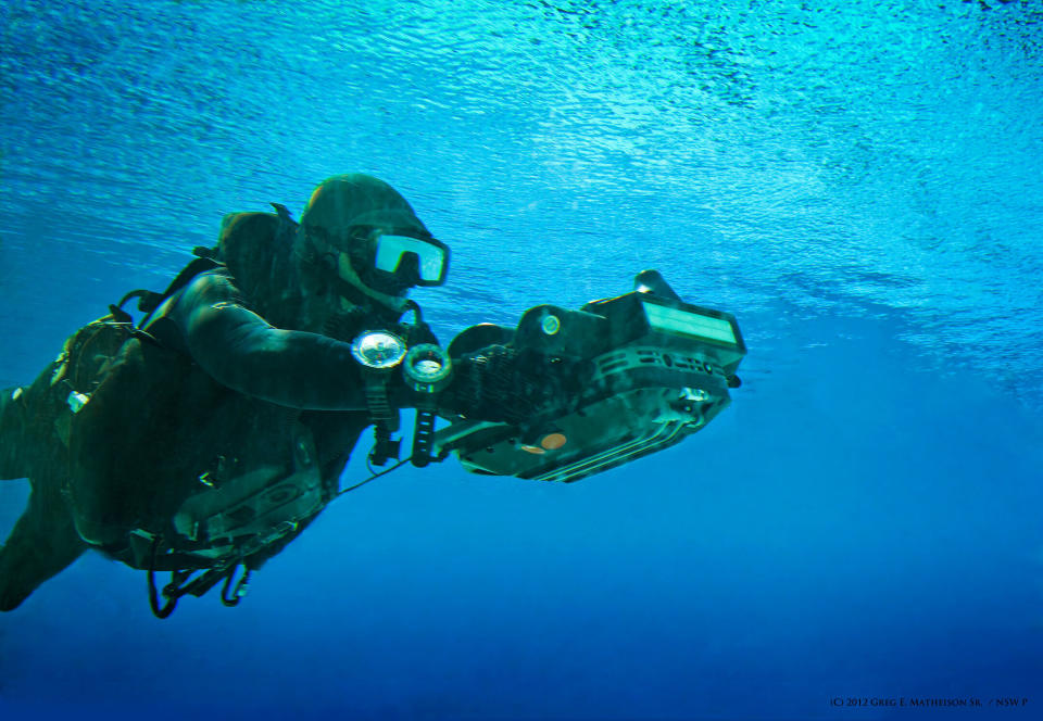 A US Navy SEAL using a computerized  HMU underwater to take measurements of a beach landing area. Photo: (C) 2011 Greg E. Mathieson Sr. / NSW Publications, LLC