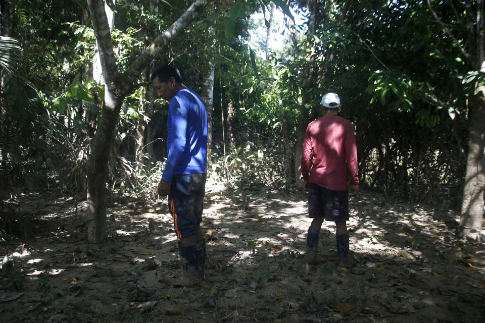 Matis Indigenous men Binan Maburu Matis, right, and Binin Matis search for British journalist Dom Phillips and Indigenous affairs expert Bruno Araujo Pereira in the Javari Valley Indigenous territory, Atalaia do Norte, Amazonas state, Brazil, Thursday, June 9, 2022. Phillips and Araujo Pereira are missing in a remote part of Brazil's Amazon region that has been marked by violent conflicts between fishermen, poachers and government agents. (AP Photo/Edmar Barros)