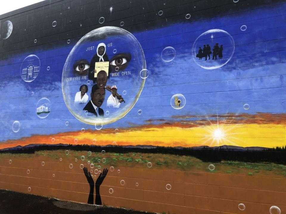 This portion of the new mural, painted by George Mayfield, depicts Black heritage. The mural is on the east side of Habitat for Humanity ReStore.