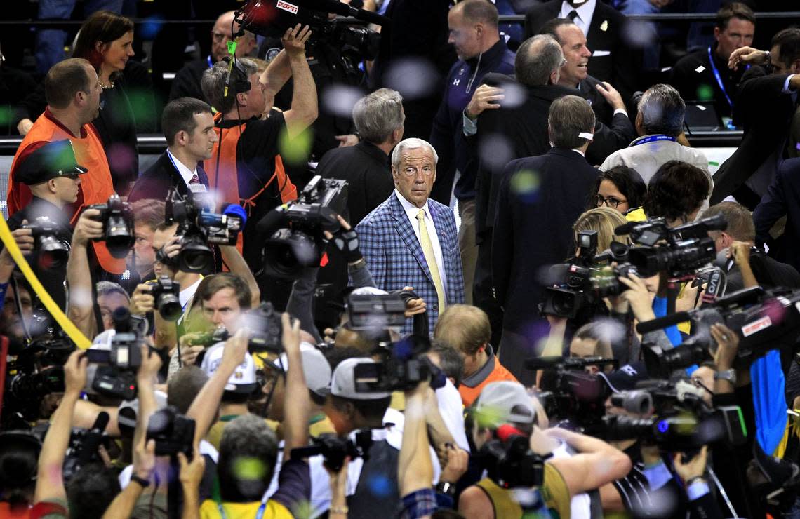 UNC head coach Roy Williams watches Notre Dame celebrate after Notre Dame’s 90-82 victory over North Carolina in the finals of the 2015 New York Life ACC Tournament at the Greensboro Coliseum in Greensboro, N.C., Saturday, March 14, 2015.